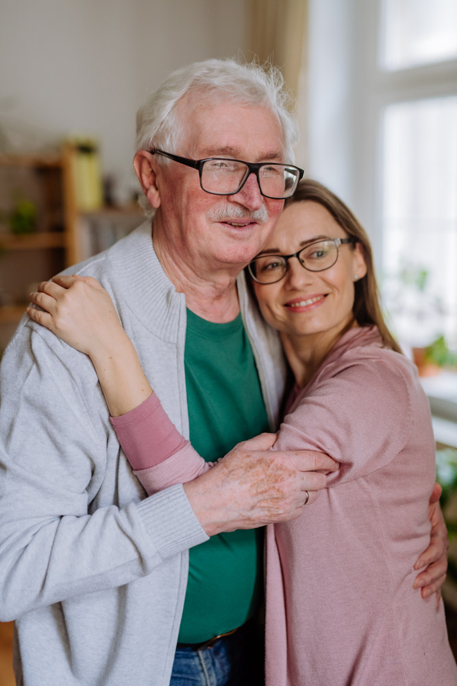 Daughter and Senior father accessing in-home funding with a reverse mortgage